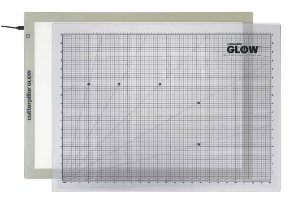 Grid cutting mat with 'GLOW' branding on a white background