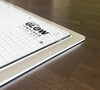 Glow tempered glass cutting mat on a wooden surface