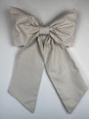 Large striped bow on a light gray background