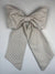 Large striped bow on a light gray background