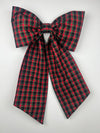 Red and green plaid bow on a white background