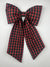 Red and green plaid bow on a white background