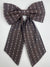 Brown patterned bow tie on a white background