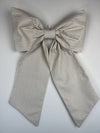 Large striped bow on a light gray background