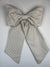Large striped bow on a light gray background